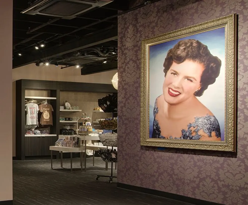 A large portrait of a smiling woman in vintage style is prominently displayed on a decorative wall inside a modern retail space
