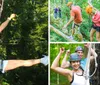 A smiling person is equipped with a harness and safety gear on a high ropes course among trees