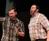 Four actors on stage display varying expressions of surprise and concern suggesting an emotional scene in a play or improvisational performance