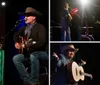 A musician in a cowboy hat is performing with an acoustic guitar on a stage singing into a microphone