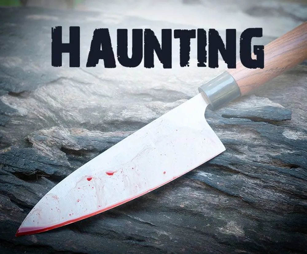 The image depicts a bloodstained kitchen knife resting on a textured surface with the word HAUNTING imposed above in large bold letters