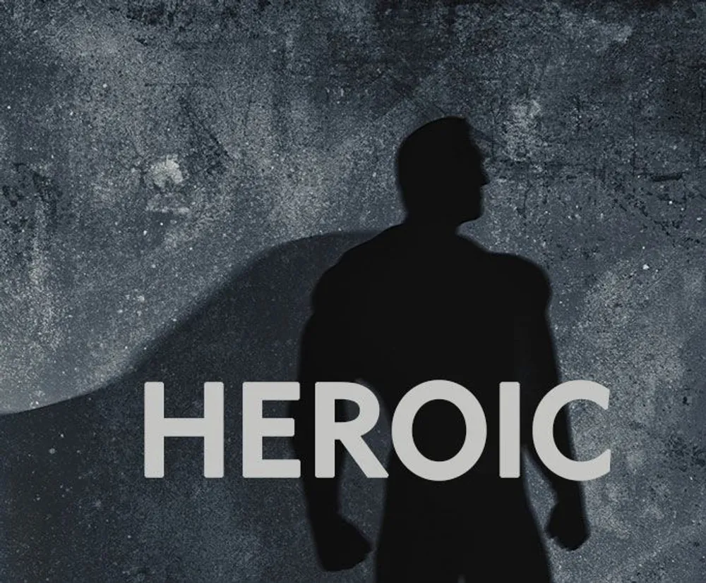 The image shows a silhouette of a person casting a shadow with the word HEROIC superimposed on a textured background