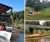 Two people are enjoying a sunny day kayaking on a calm body of water near a rustic wooden structure