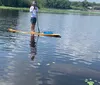 A smiling man and woman are enjoying kayaking together with a manatee visible in the water near them