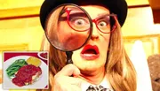 The image shows a person with exaggerated facial expressions, wearing a hat and glasses, holding a large magnifying glass up to one eye.