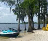 A family of four is posing with thumbs up on a yellow jet ski in a large body of water surrounded by trees under a partly cloudy sky