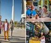 A group of people are enjoying their visit to a space center with rockets on display in the background