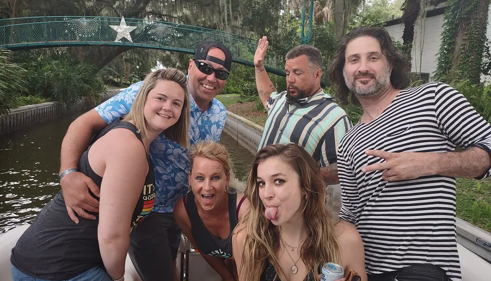 A group of five adults are enjoying themselves on a boat displaying various playful gestures and expressions