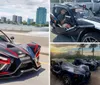 A person is driving a three-wheeled Polaris Slingshot on a bridge with a city skyline in the background