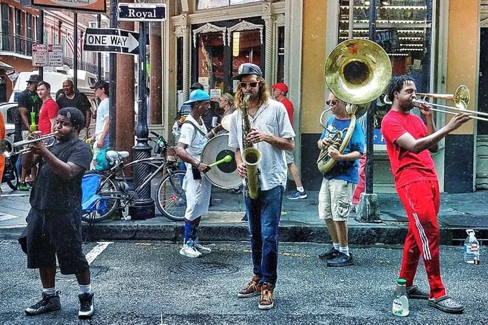 A diverse group of street musicians is performing on a vibrant city corner with onlookers in the background