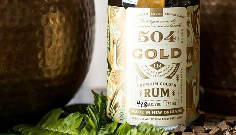 The image features a bottle of 504 Gold premium golden rum with a label accentuating that it is made in New Orleans with local sugar cane