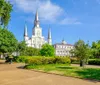This is an image of the iconic St Louis Cathedral located in the French Quarter of New Orleans viewed from Jackson Square on a sunny day