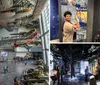 The image shows the interior of an aviation museum with several aircraft suspended from the ceiling and military vehicles on the floor as visitors explore the exhibits