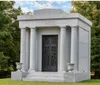 The image shows a stately white mausoleum with the name RICE inscribed above the entrance flanked by classical columns and set against a backdrop of green trees