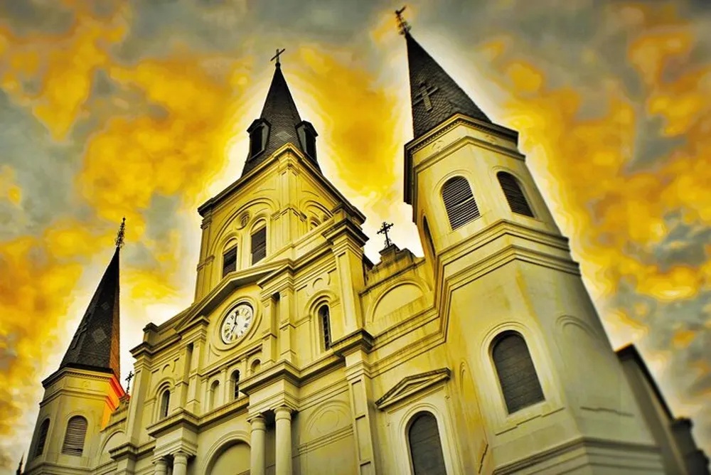 A majestic church with twin spires reaches into a dramatic golden-hued sky