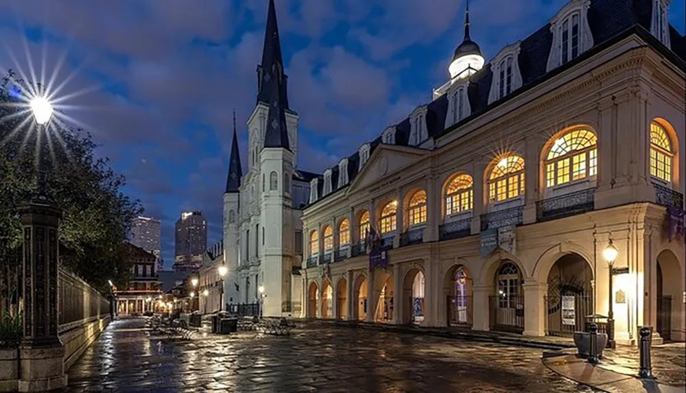 The image features Jackson Square with the iconic St Louis Cathedral at twilight displaying the stunning architecture and lighting of the French Quarter in New Orleans