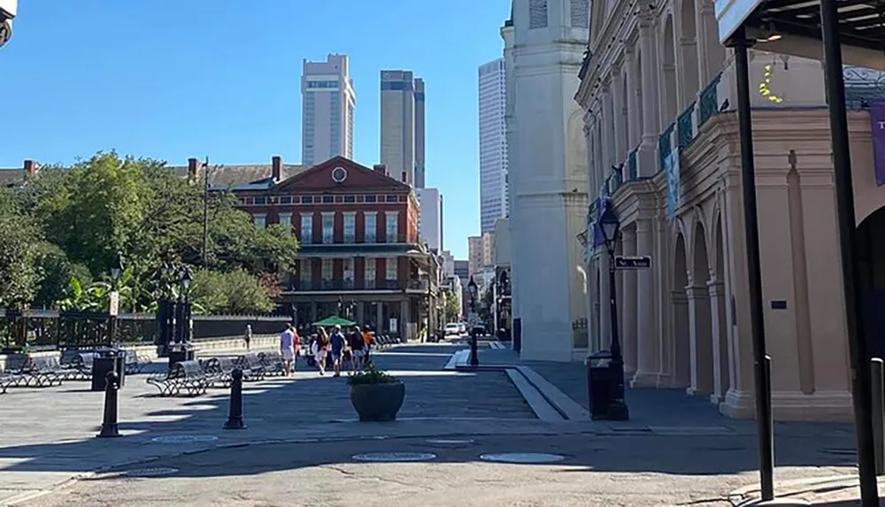 A sunny day showcases pedestrians and historic architecture juxtaposed with modern skyscrapers in what appears to be a vibrant city setting