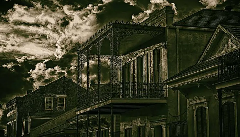 The image depicts a moody sepia-toned scene of the exterior of old ornate buildings with wrought-iron balconies set against a dramatic and cloudy sky