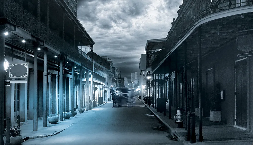 The image depicts a moody monochrome scene of an empty street with a horse-drawn carriage capturing the historic charm of what appears to be an old city quarter at dusk or dawn