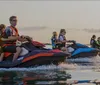 A group of people are riding jet skis on the water seemingly in a coordinated activity or tour