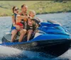 A group of people are riding jet skis on the water seemingly in a coordinated activity or tour