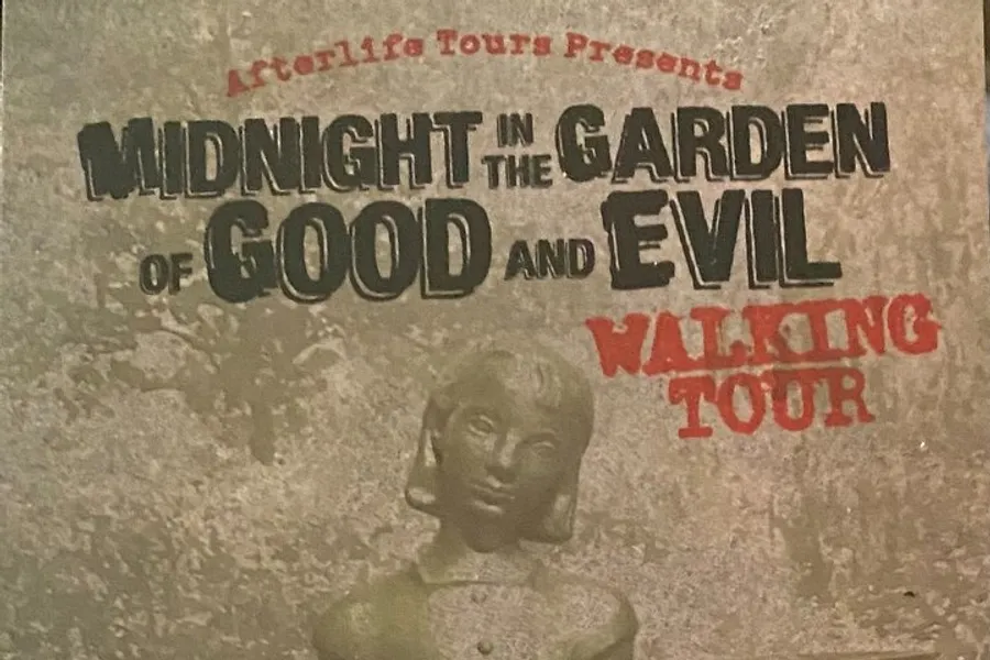 The image is a poster for Midnight in the Garden of Good and Evil Walking Tour presented by Afterlife Tours, featuring a graphic of a statue's face.