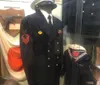 The image displays a mannequin dressed in a military uniform with a name tag reading WESTMORELAND adorned with US Army patches and generals stars on the hat