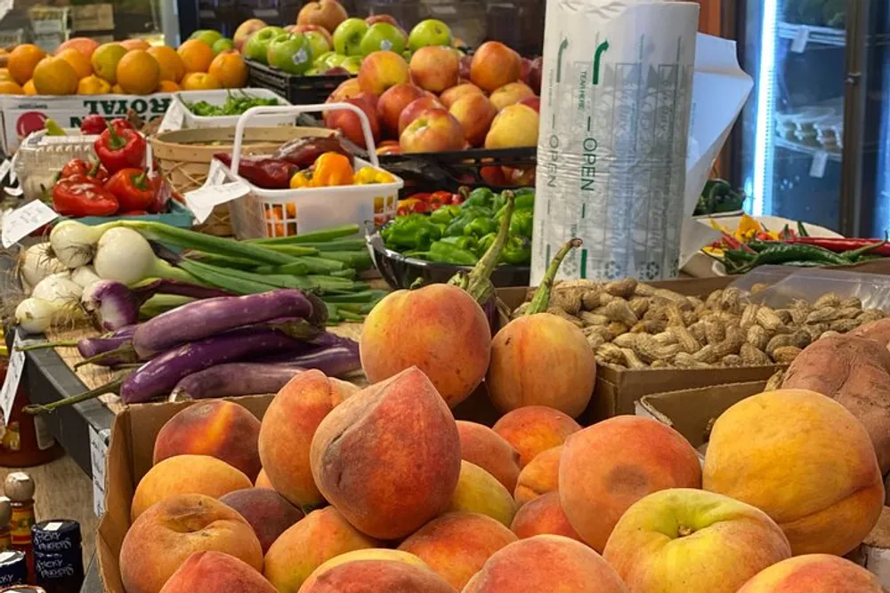 The image shows a colorful display of various fresh fruits and vegetables likely at a market or grocery store