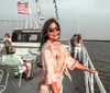 The image shows a large boat named Charleston Princess on the water with a bridge in the background and an inset photo displaying a buffet with various dishes