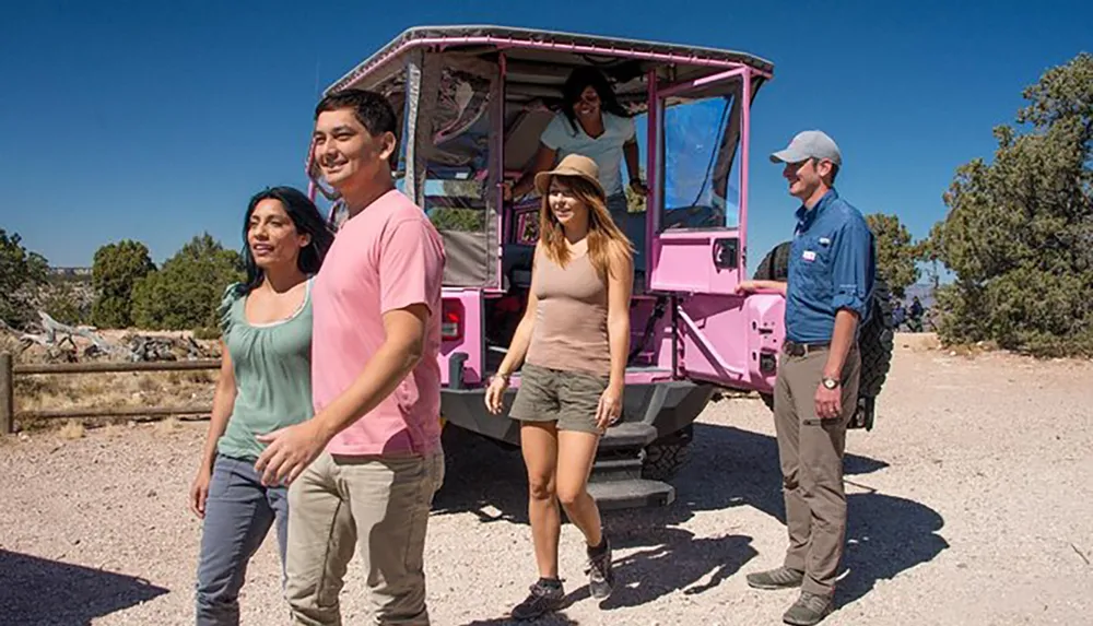 A group of tourists appears to be enjoying an outdoor excursion disembarking from a pink open-sided vehicle with a guide standing by