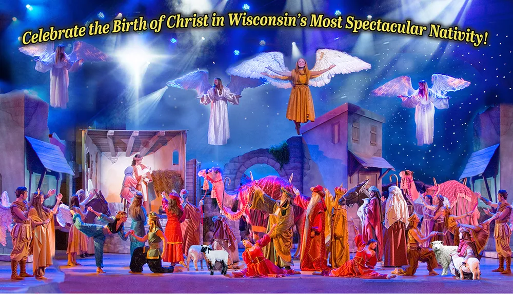 The image displays a vibrant theatrical production depicting the Nativity scene with performers dressed as angels shepherds and wise men accompanied by live animals under a starry sky with text promoting the event in Wisconsin