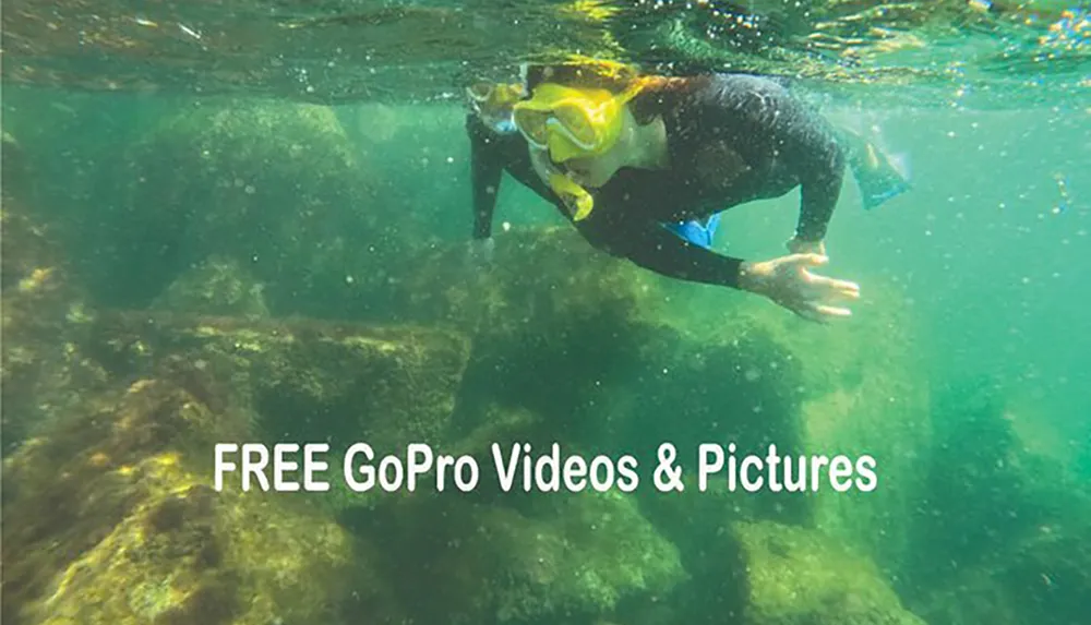 A person is snorkeling underwater near a rocky seabed captured in a photograph with a text overlay promoting FREE GoPro Videos  Pictures