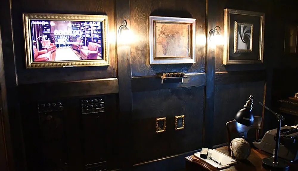 The image shows a dark moody room styled with a vintage aesthetic featuring an ornate desk with a lamp and globe walls adorned with framed artwork and wall sconces and a television displaying a luxurious interior scene