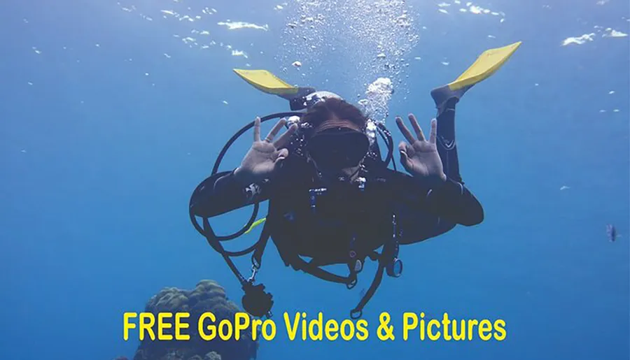 A scuba diver is making a hand signal underwater, with text overlay promoting free GoPro videos and pictures.