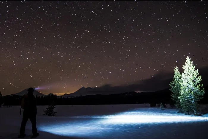 Moonlight Snowshoe Tour Under a Starry Sky Photo