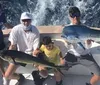 A person is holding a large fish with a big smile on their face standing on a boat with the ocean in the background