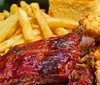 A riverboat named Jungle Queen IV offers barbeque dining experiences as indicated by the inset images of various grilled foods