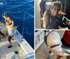 Two individuals are posing with a large fish on a boat showcasing their catch with cheerful expressions