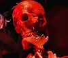 The image depicts a sinister red-lit skull possibly part of a horror-themed display or decoration evoking a macabre or eerie atmosphere