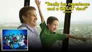 A man and a child joyfully look out at a scenic view, with a quote saying, 