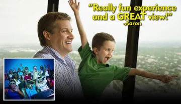 A man and a child joyfully look out at a scenic view, with a quote saying, 