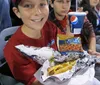 The collage depicts various scenes from a baseball game featuring players in white uniforms with Missions on the front capturing actions such as pitching batting team celebration and a view of the game with spectators in the stands