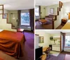 This image shows a neatly arranged hotel room with two beds with white linens and burnt orange bedspreads flanked by wooden bedside tables and headboards and decorated with framed artwork on the walls