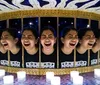 The image shows a laughing girls reflection repeated multiple times in curved mirrors creating a circular pattern of identical joyous expressions