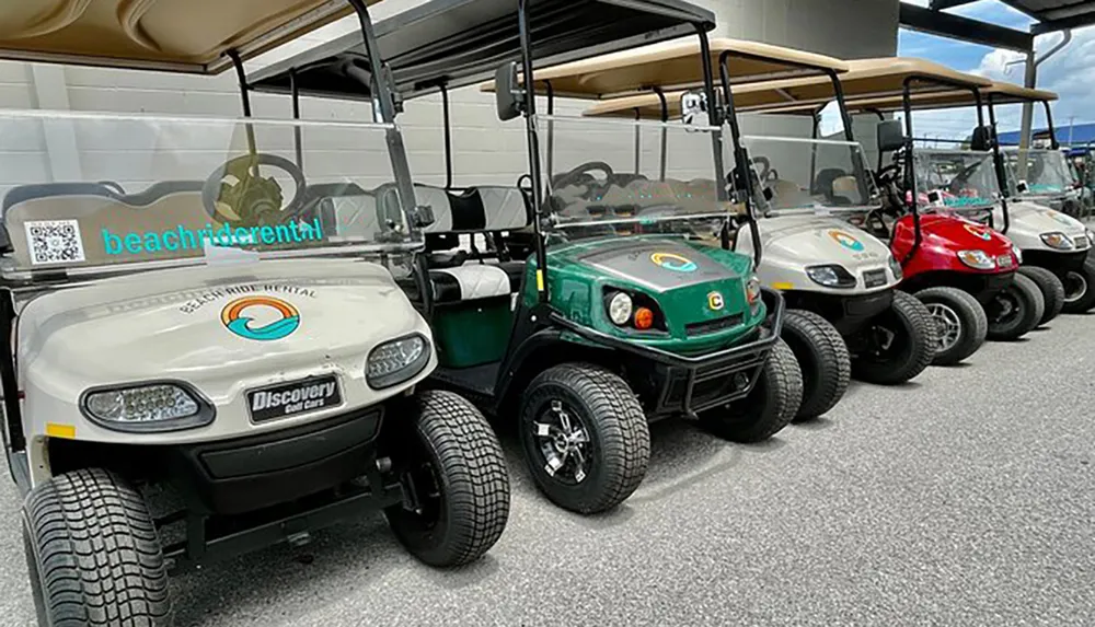 A row of parked golf carts some with a logo indicating they are available for rent