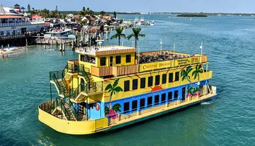 A brightly painted paddleboat with the name 