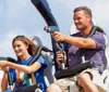 Two people are joyfully experiencing a ride in a blue roller coaster car with dynamic expressions and windswept hair