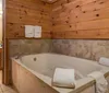 The image is a collage showcasing various rooms and amenities of a hotel including a wood-paneled bedroom a bathroom with a whirlpool tub another angle of a bedroom and an outdoor swimming pool area