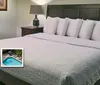 The image features a cozy hotel room with a neatly made bed alongside highlights of amenities such as free WiFi an outdoor pool and a complimentary hot breakfast