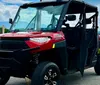 The image features a close-up of an off-road vehicle with a windshield and light bar accompanied by a logo that says Wranglers and Razors and an inset image showing another similar off-road vehicle